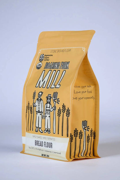 Bag of bread flour from Roanoke Fork Mill on a light gray background