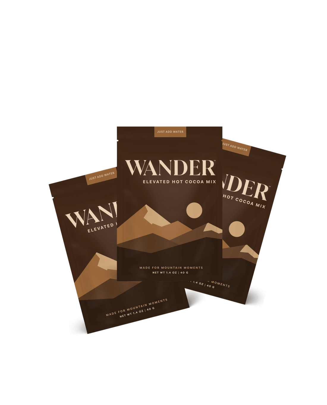 Three packages of Wander Elevated Hot Cocoa Mix on a white background