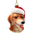Dog-shaped Christmas ornament wearing a Santa hat on a white background