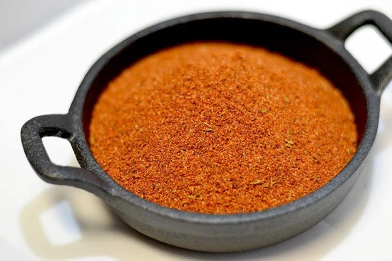 the spice guy blackened red fish magic in cast iron pan