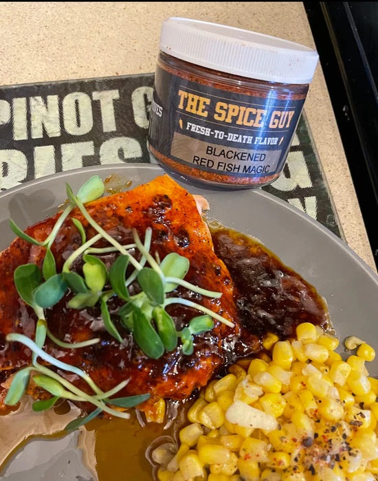 blackened red fish magic blend on fish with corn