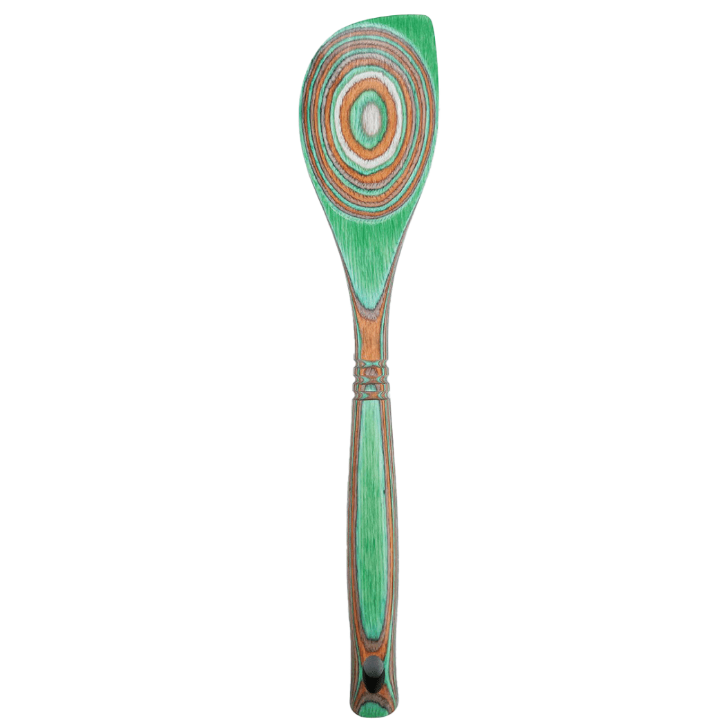 Decorative wooden spoon with a green handle and circular pattern on a white background