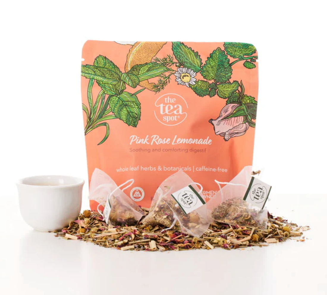Tea packaging with tea bags and loose tea on a white background