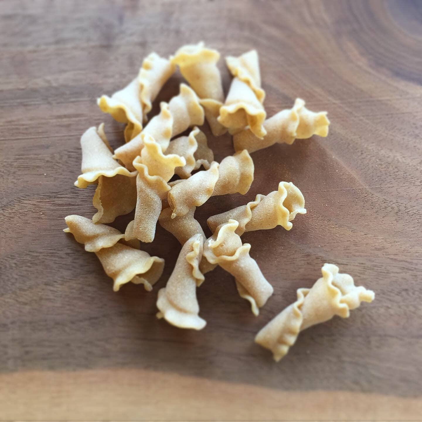 Uncooked pasta on a wooden surface