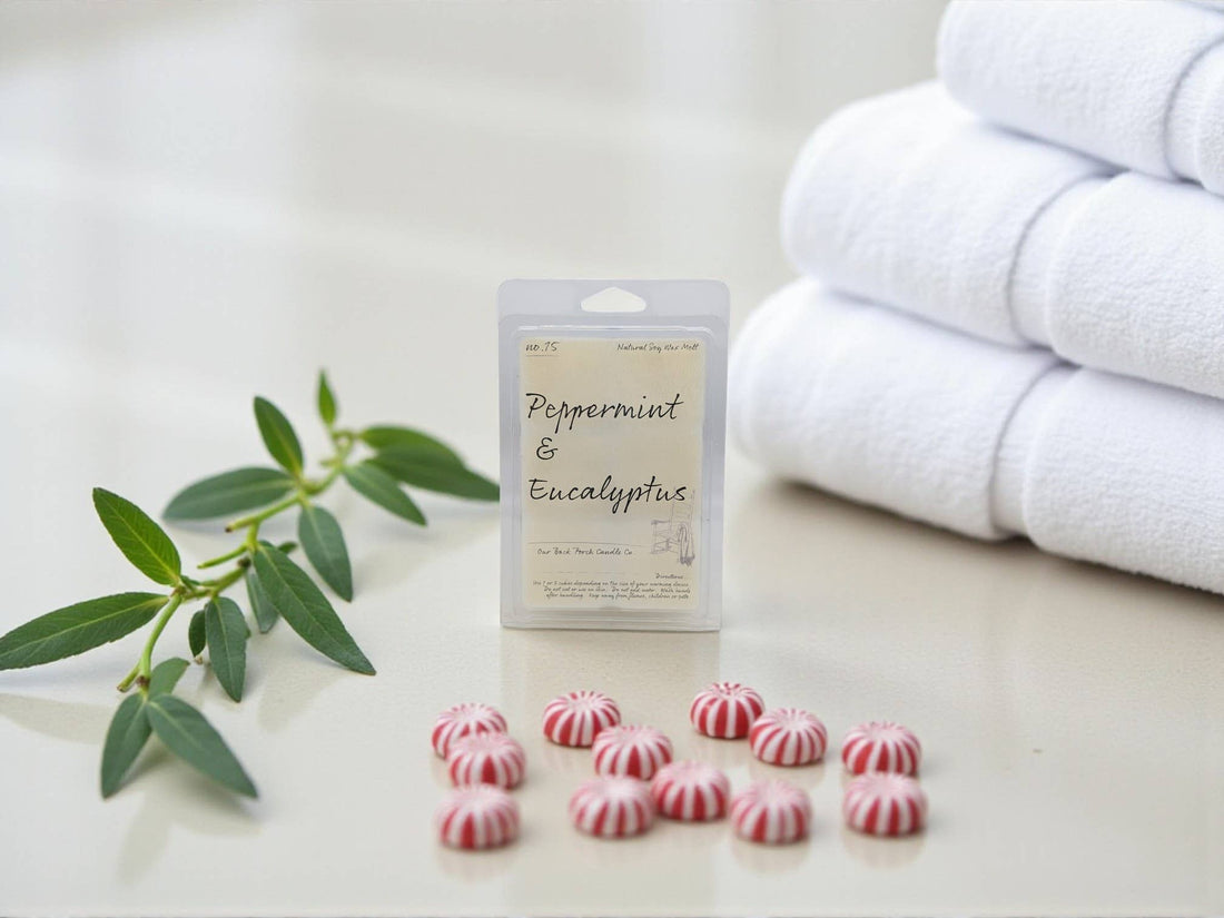 Wax tarts with peppermint and eucalyptus label next to a stack of white towels on a light surface.