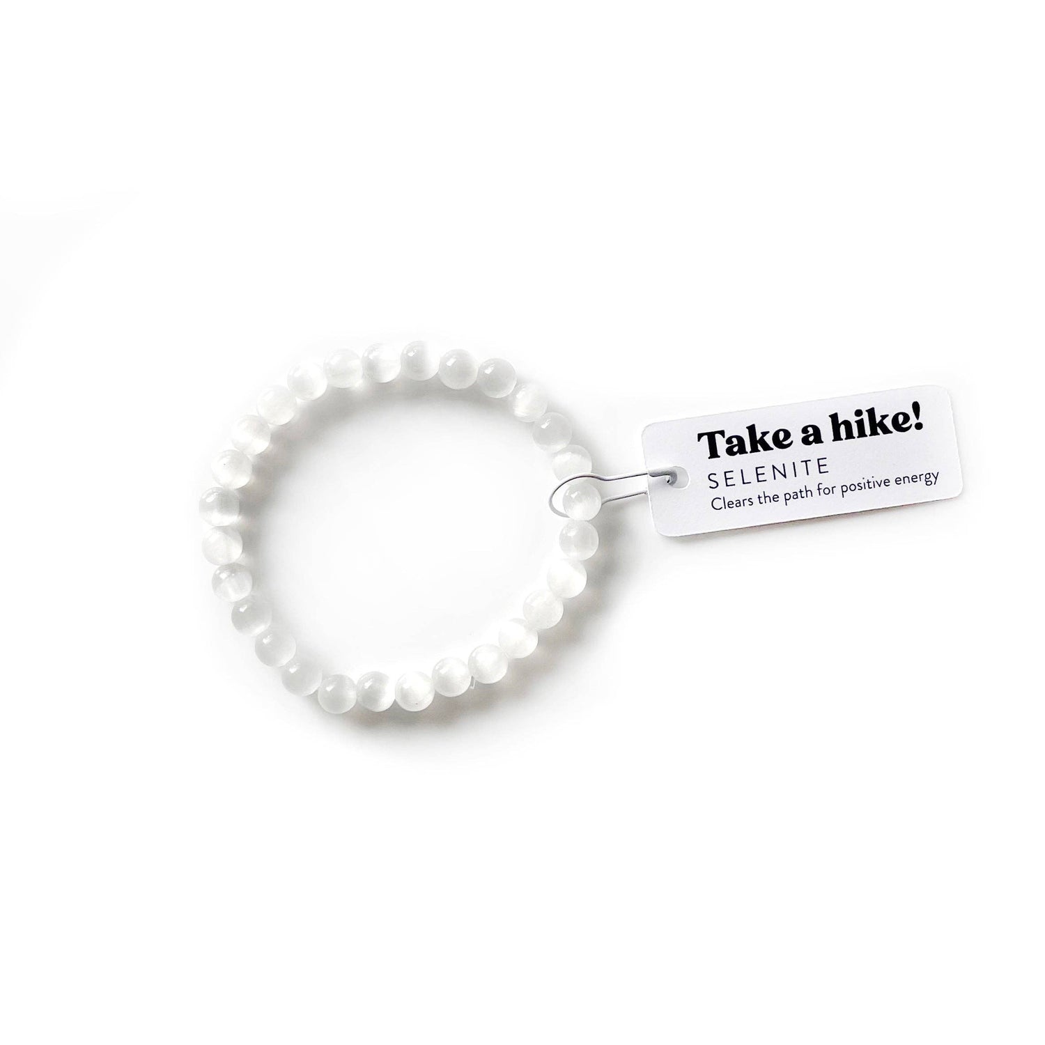 White beaded bracelet with a tag on a white background