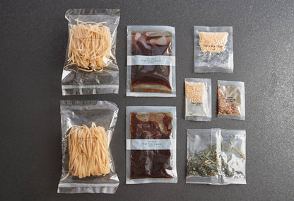 Assorted food packages on a gray surface