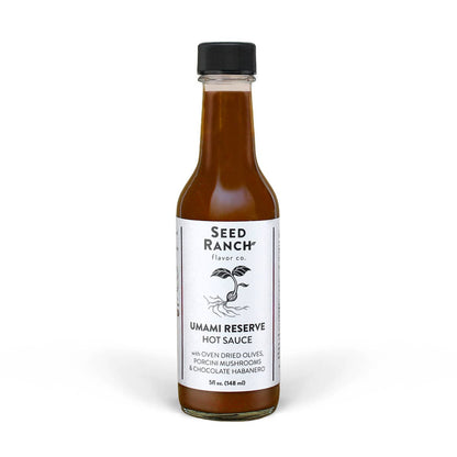 Bottle of Seed Ranch Umami Reserve Hot Sauce on a white background