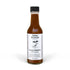Bottle of Seed Ranch Umami Reserve Hot Sauce on a white background