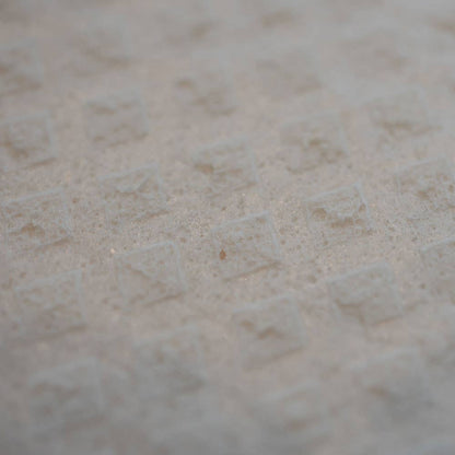 Close-up of a textured beige surface