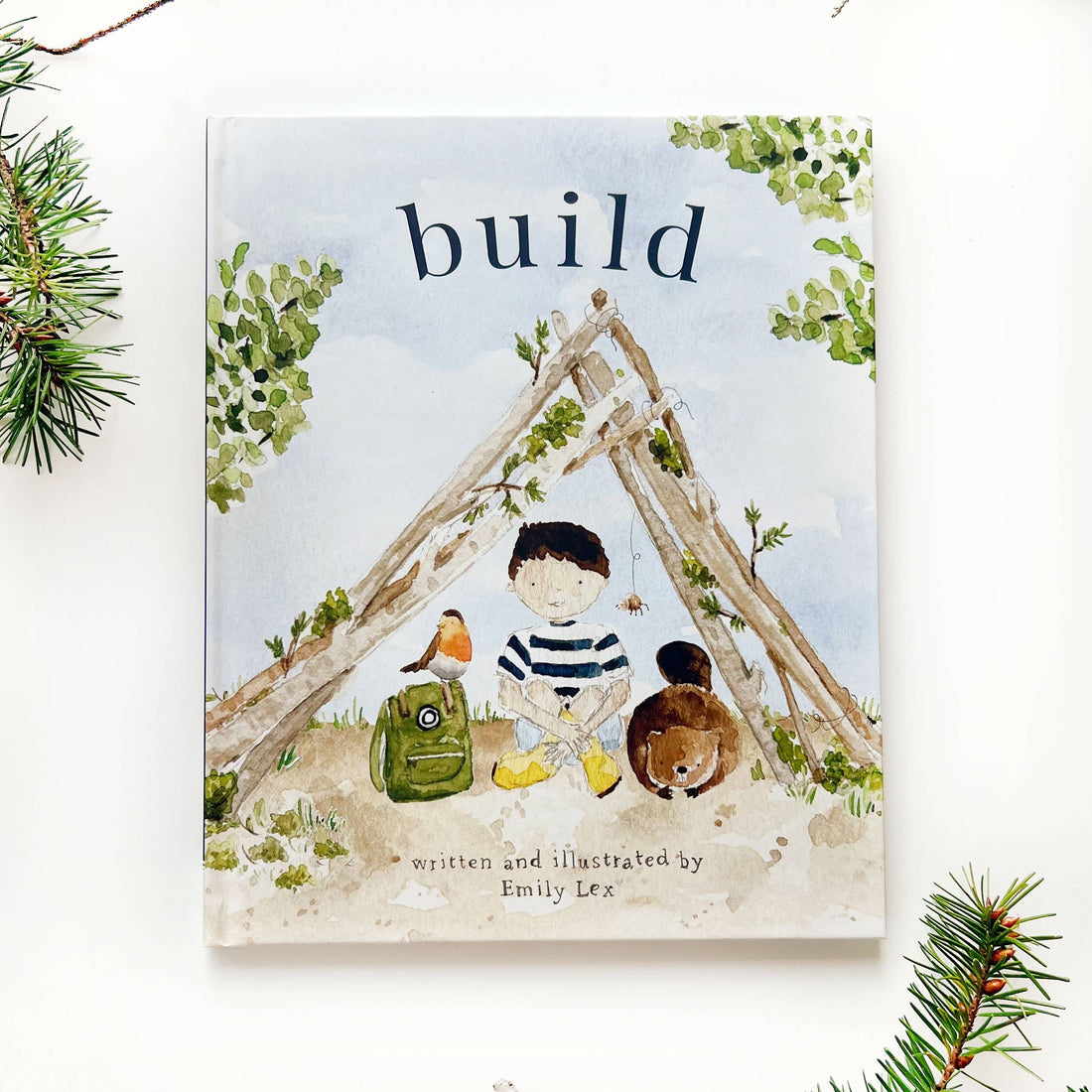 Book cover with illustration of a child, teddy bear, and treehouse, titled &
