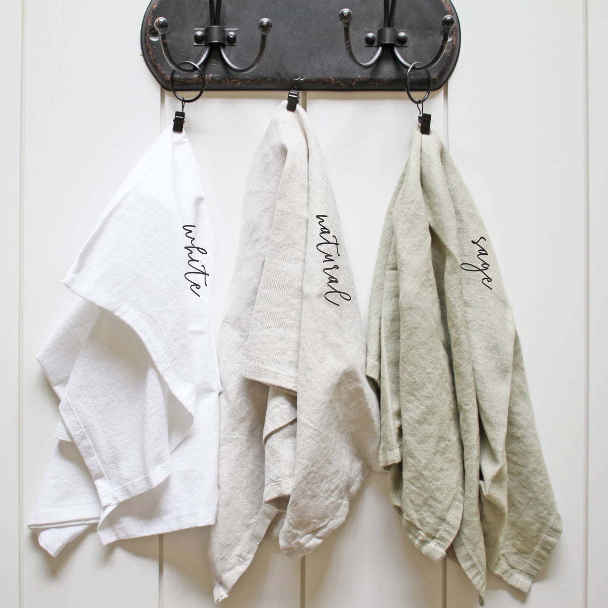 Three dishtowels labeled &