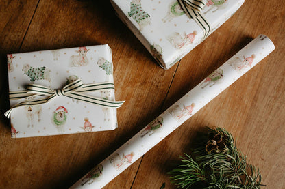 Gift wrap with festive design on a wooden surface
