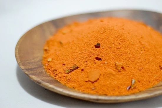 the spice guy mango chipotle rub in wooden bowl