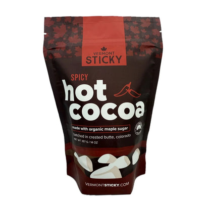 Bag of Vermont Sticky Spicy Hot Cocoa with maple leaf design on a white background